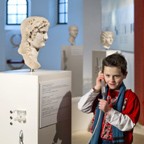 A boy listens to stories told in the exhibition. 