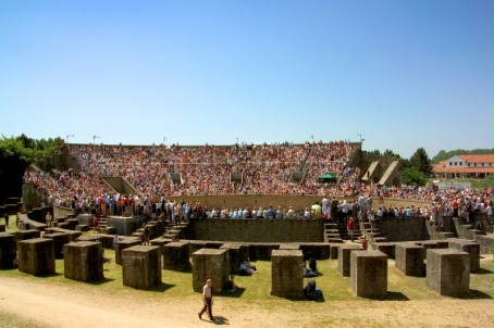 View of the pillars and packed stands of the reconstructed amphitheatre.