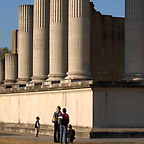 View of five partially reconstructed pillars on the long side of the harbour temple.