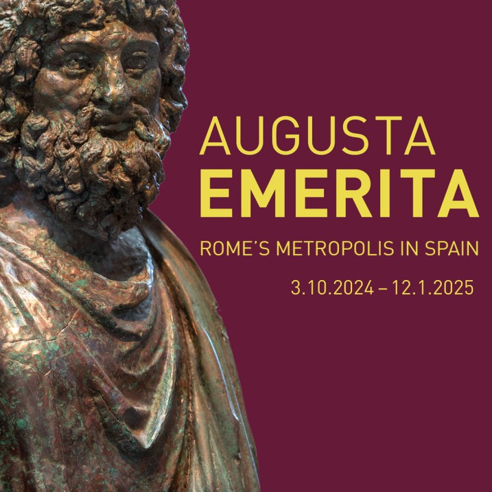 Key Visual of the AUGUSTA EMERITA exhibition, the head of a bearded bronze statuette with the typo details of the exhibition