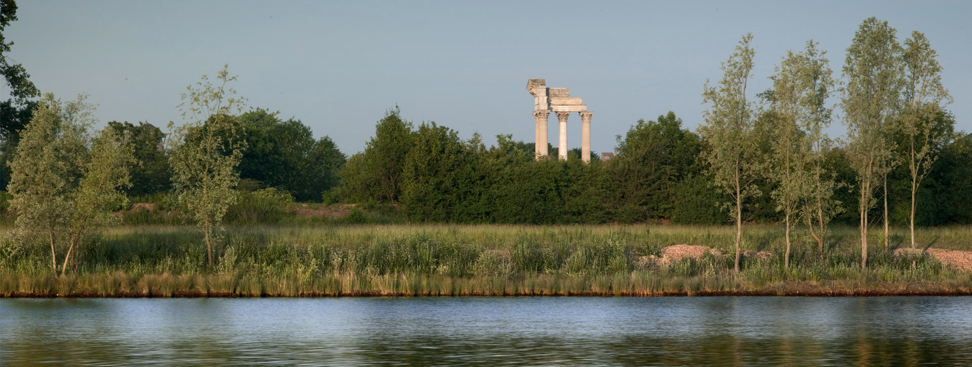 Panorama of the South Sea with the shore and columns of the harbour temple in the background