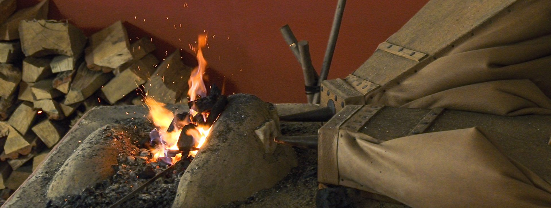 Close-up of a forge fire with bellows