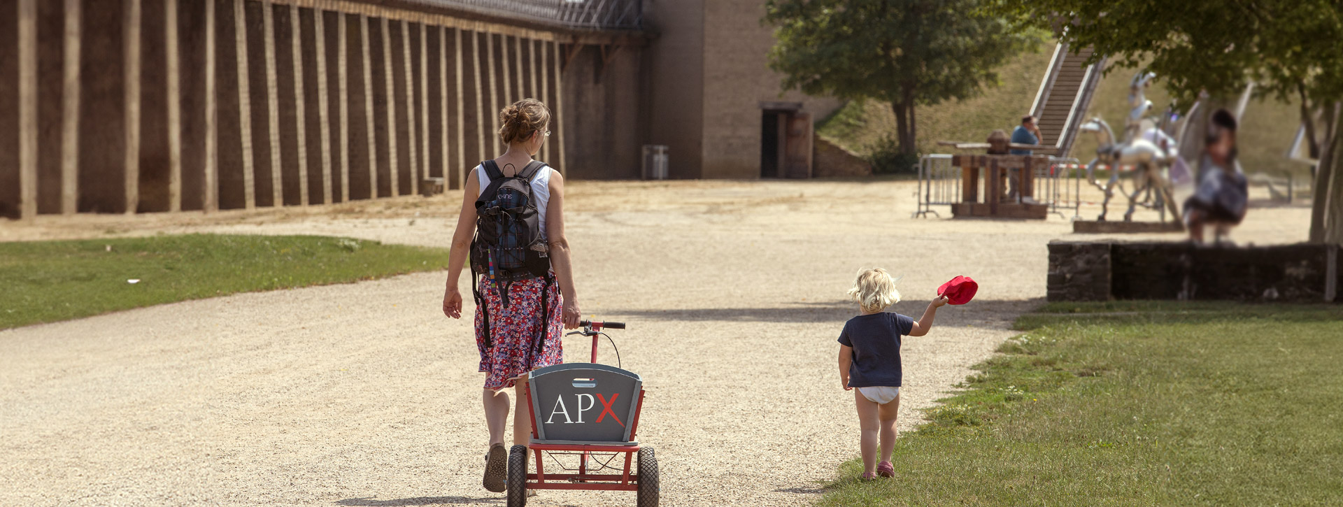 Mother and child with a handcart