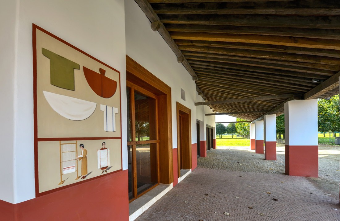 Covered colonnade with shop doors on the left