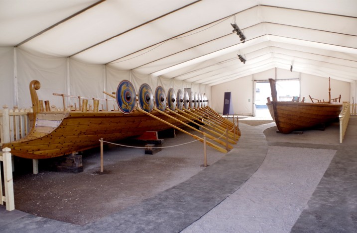 Two wooden Roman ships next to each other in the large ship's tent