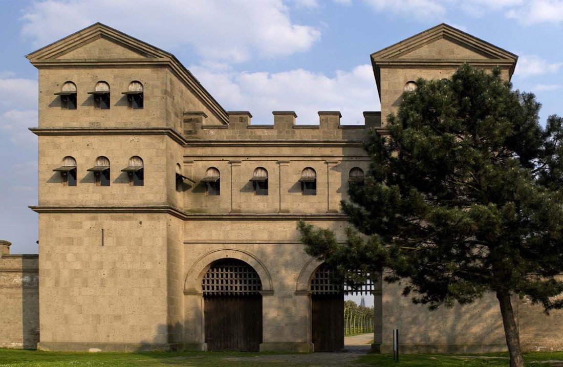 The Roman north gate with a tree on the right side