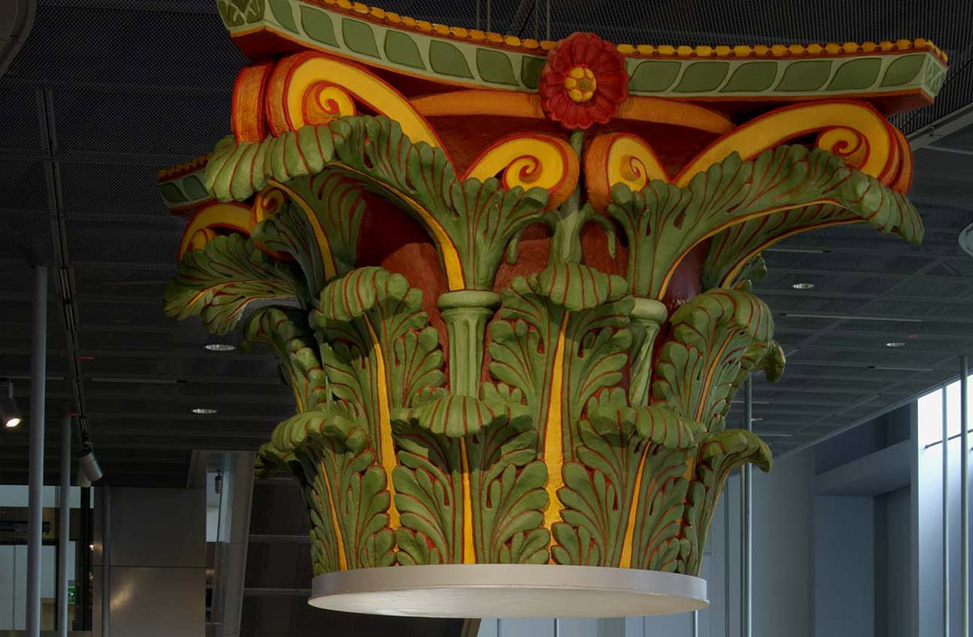 Reconstructed, colourfully painted capital from the harbour temple in the Roman Museum